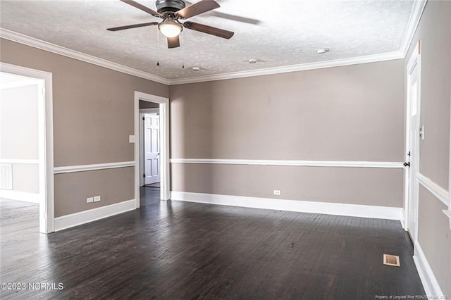 spare room with a textured ceiling, ornamental molding, and dark wood-type flooring