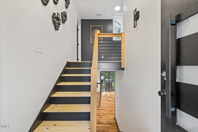 staircase featuring wood finished floors