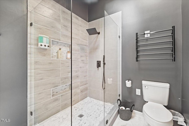 full bathroom featuring radiator, baseboards, toilet, and a tile shower