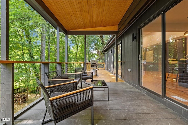 sunroom / solarium with wood ceiling