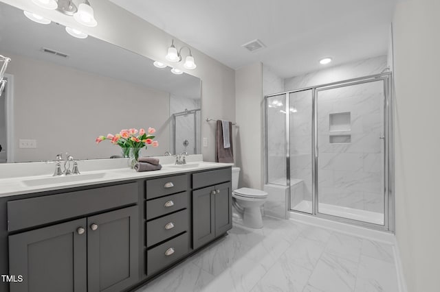 bathroom with toilet, a sink, visible vents, marble finish floor, and double vanity