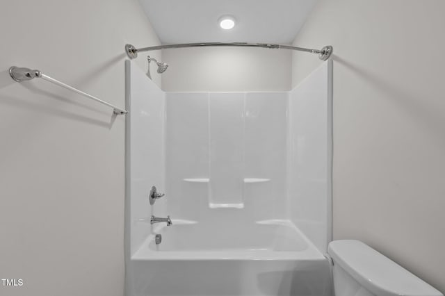 bathroom featuring toilet and shower / bathtub combination