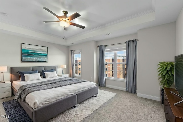 bedroom with baseboards, visible vents, a raised ceiling, and carpet flooring