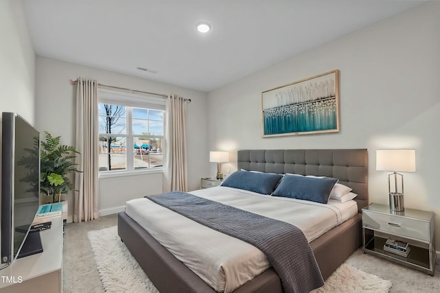 bedroom featuring carpet flooring, visible vents, and baseboards