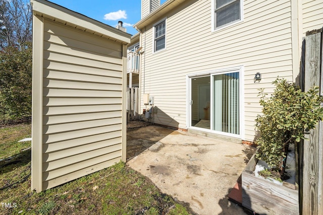 back of property with a patio