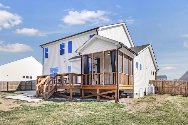 back of property with a fenced backyard, a sunroom, a lawn, a wooden deck, and a patio area