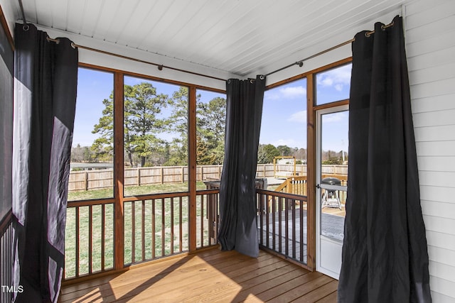 sunroom featuring wooden ceiling