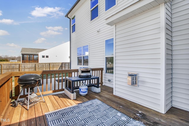 deck with fence and grilling area