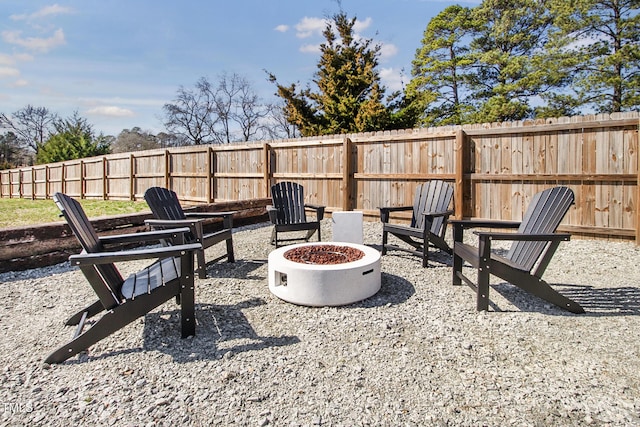 view of patio with an outdoor fire pit and a fenced backyard