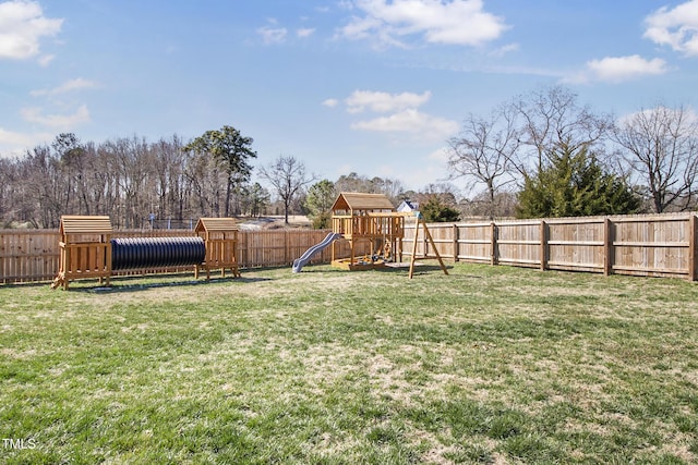 view of yard with a fenced backyard and a playground