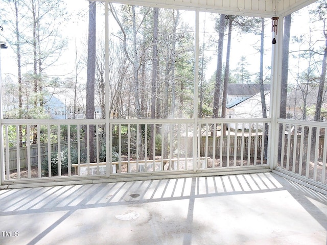 unfurnished sunroom featuring a wealth of natural light