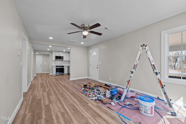 2810 Hickory Hill Rd, Burlington, NC 27215 - playroom featuring light wood-style floors, baseboards, visible vents, and a ceiling fan