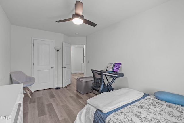 bedroom with a ceiling fan and wood finished floors