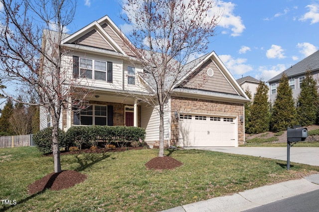 view of front of home featuring a front yard, an attached garage, stone siding, and driveway