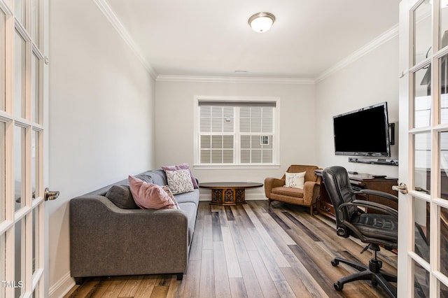 office space with french doors, crown molding, and wood finished floors