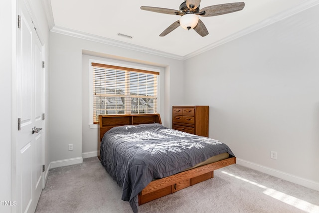 bedroom with baseboards, visible vents, ornamental molding, and light colored carpet