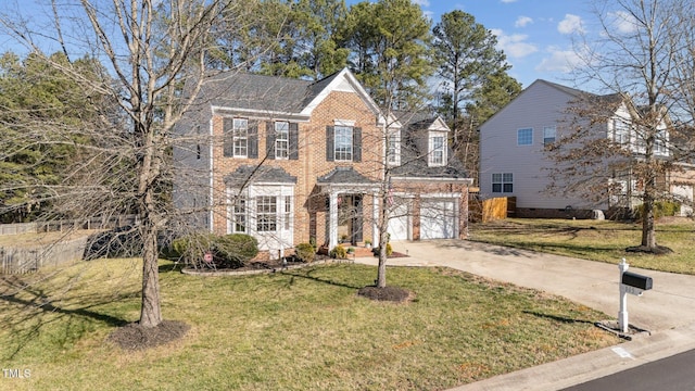 view of front of home featuring driveway, brick siding, and an attached garage