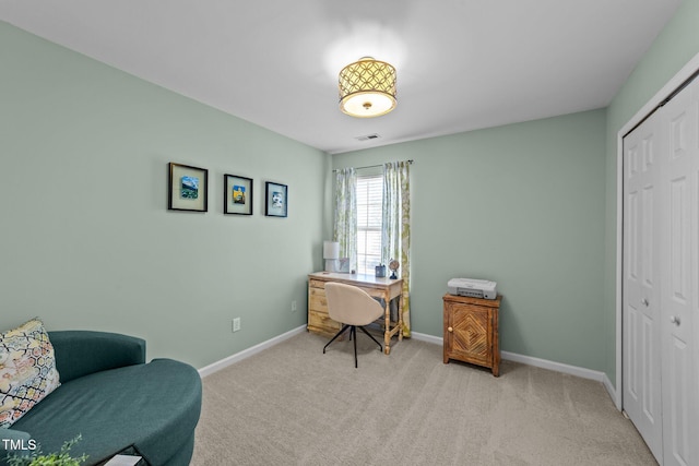 office space featuring carpet floors and baseboards
