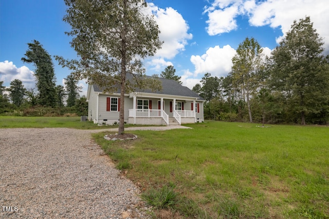 view of front of property with a front yard, crawl space, covered porch, and gravel driveway