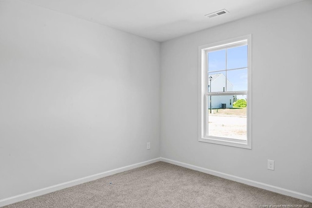 814 Tori Dr, Spring Lake, NC 28390 - spare room featuring carpet flooring and baseboards