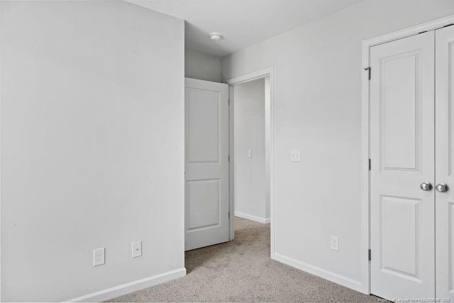 814 Tori Dr, Spring Lake, NC 28390 - unfurnished bedroom featuring carpet floors, baseboards, and a closet