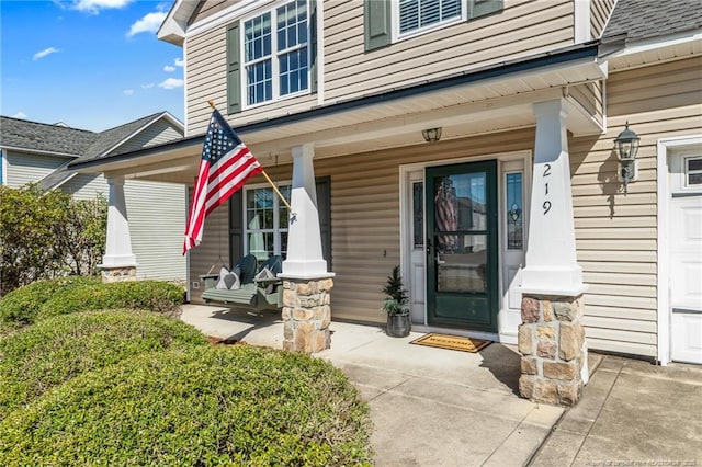 doorway to property with a porch