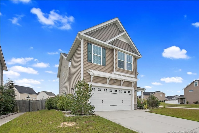 view of front of property with driveway, a front lawn, an attached garage, and fence