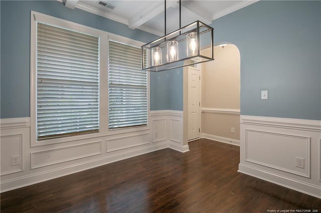 unfurnished dining area with arched walkways, a wainscoted wall, dark wood-style flooring, visible vents, and crown molding