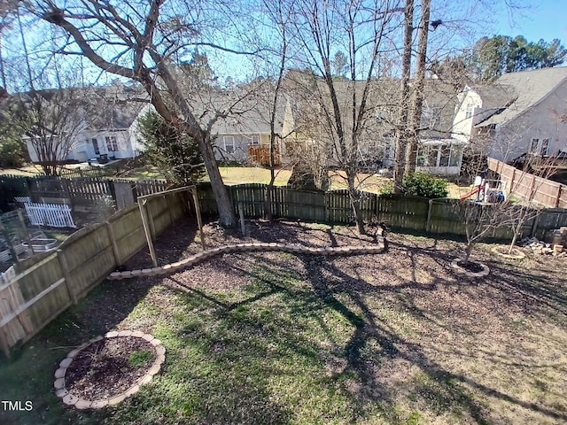 view of yard with a fenced backyard