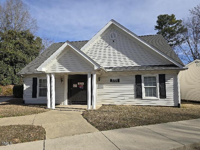 view of front of home with a shingled roof