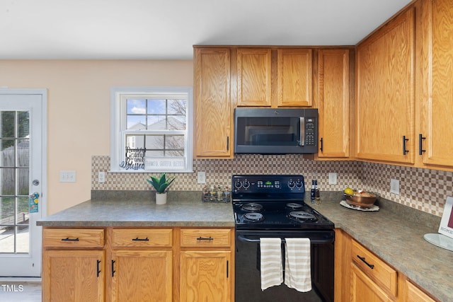 kitchen with dark countertops, electric range, and tasteful backsplash