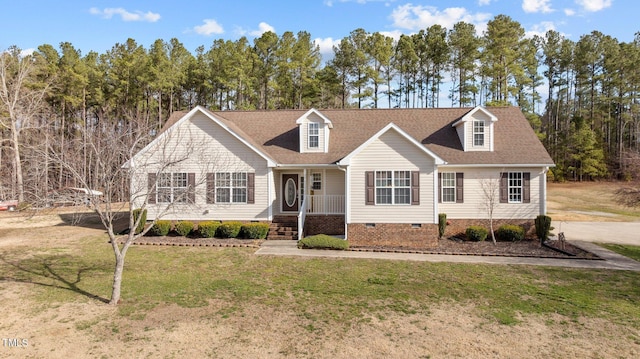 new england style home with crawl space, roof with shingles, and a front yard