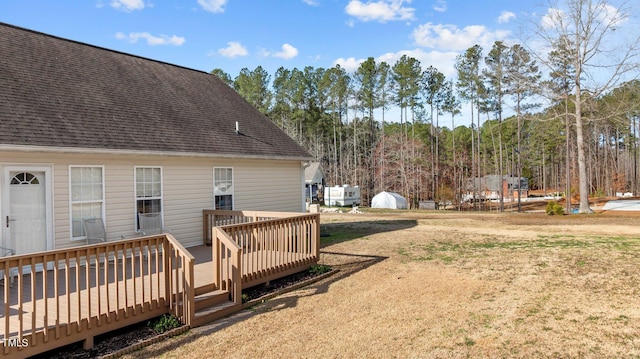 view of yard featuring a wooden deck