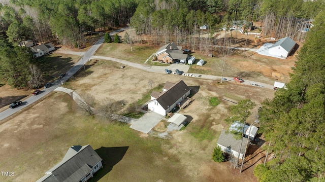 drone / aerial view featuring a forest view