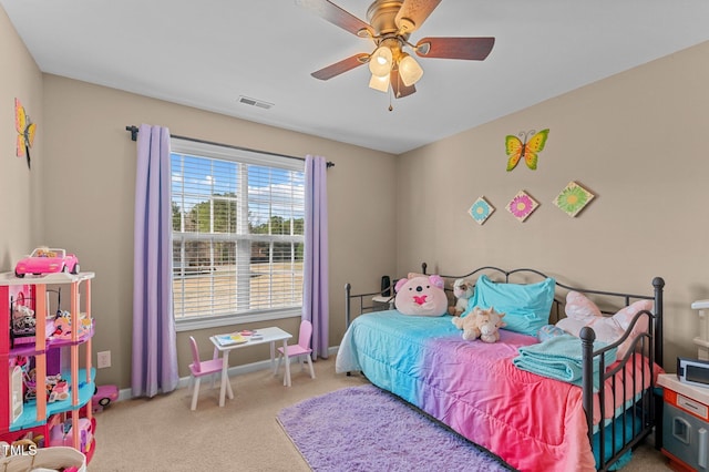 bedroom featuring visible vents, baseboards, a ceiling fan, and carpet flooring