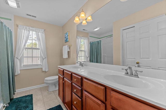 bathroom with a sink, visible vents, and a healthy amount of sunlight