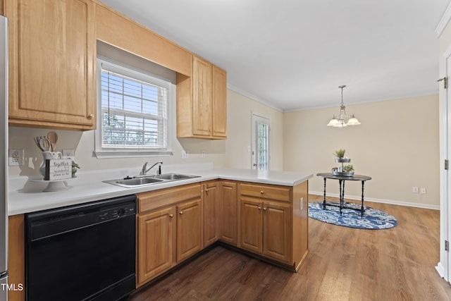 kitchen featuring dark wood-style flooring, light countertops, a sink, dishwasher, and a peninsula