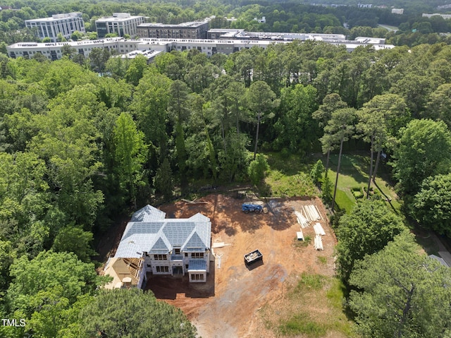 3601 Alamance Dr, Raleigh, NC 27609 - birds eye view of property with a wooded view