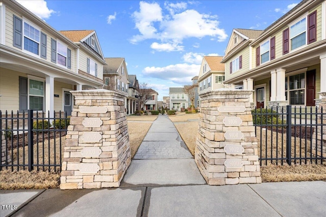 exterior space with fence and a residential view