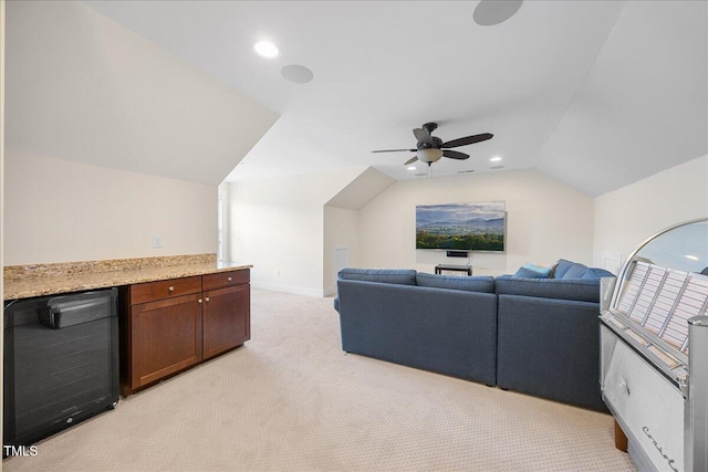 living area featuring recessed lighting, beverage cooler, light carpet, a ceiling fan, and vaulted ceiling