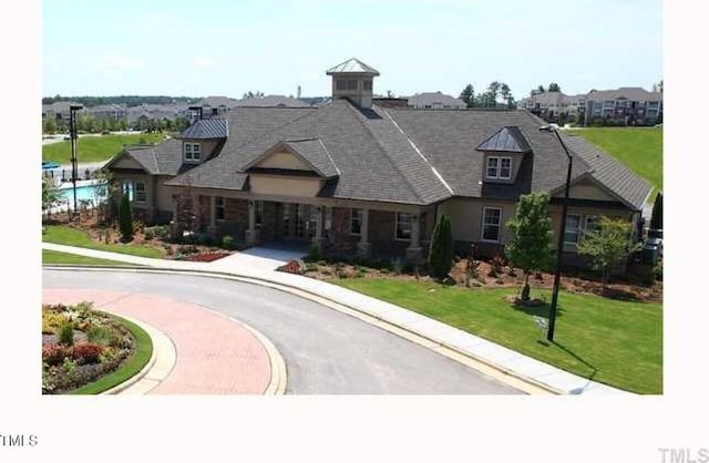 view of front of home with a front lawn