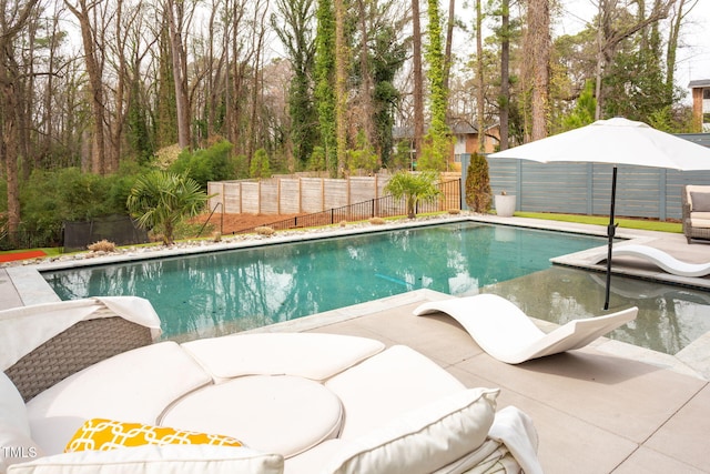 view of swimming pool with a fenced in pool and a fenced backyard