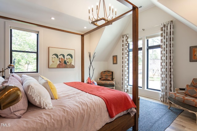 bedroom with recessed lighting, vaulted ceiling, multiple windows, and wood finished floors