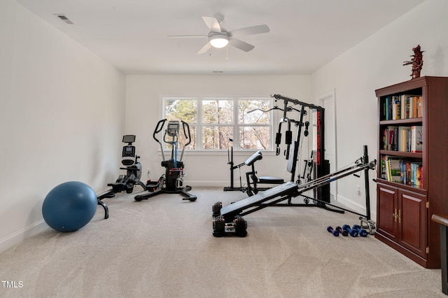 exercise area with carpet floors, baseboards, visible vents, and a ceiling fan