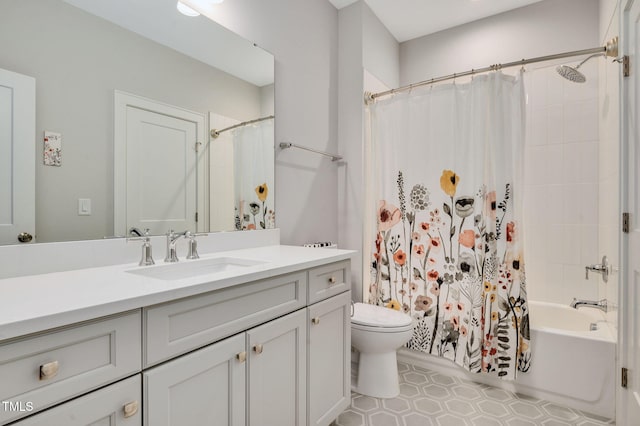 full bathroom with shower / tub combo with curtain, vanity, and toilet