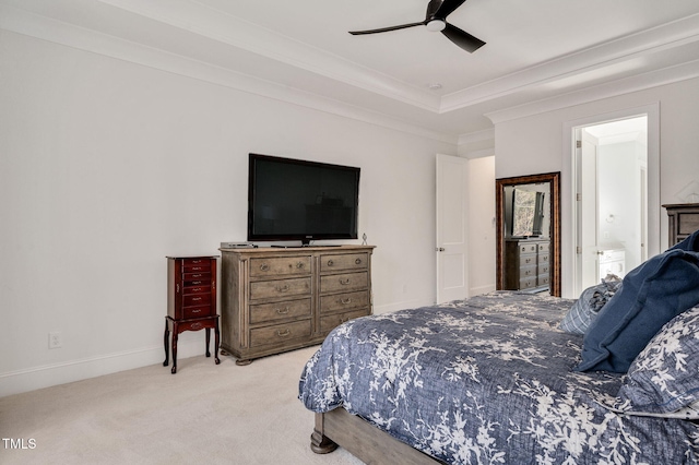 bedroom with baseboards, a raised ceiling, ceiling fan, ornamental molding, and carpet