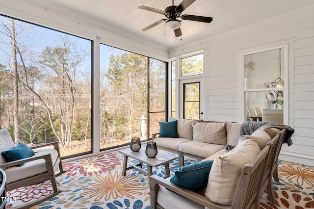 sunroom with a ceiling fan