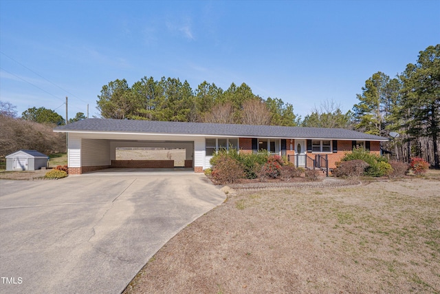 6605 Pearces Rd, Louisburg, NC 27549 - ranch-style house with driveway, an attached carport, covered porch, a front yard, and brick siding