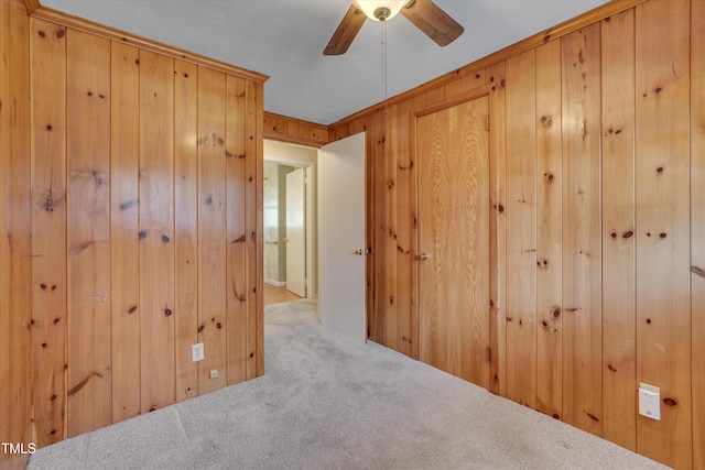 6605 Pearces Rd, Louisburg, NC 27549 - unfurnished room featuring wooden walls, a ceiling fan, and carpet