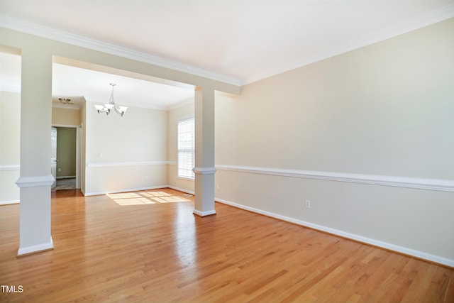 unfurnished room featuring light wood-type flooring, baseboards, crown molding, and ornate columns